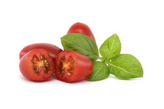 Close-up of fresh Roma tomatoes, including halved ones, alongside basil leaves on a white background. Perfect for illustrating healthy eating and fresh ingredients.