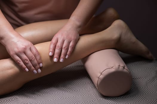 Close-up of a woman's leg massage in a salon