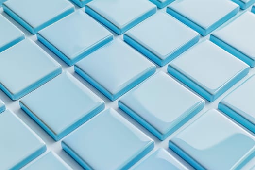 A close up view of blue squares stacked neatly on a white surface, showcasing symmetry and patterns