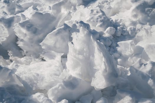 texture of pure white snow in a snowdrift in winter close-up