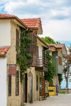 Restored houses with bay windows on the historical streets of Side Antalya