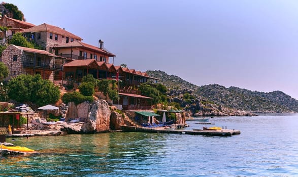 Uncover a serene cove with charming stone cottages, a floating dock, and breathtaking views. Dive into the clear waters, bask in the sun, and embrace the tranquility of this hidden gem by the sea.