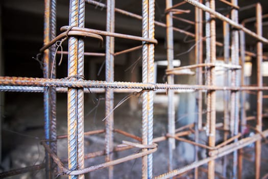 Frame structure for the basement made of reinforcement is ready for placing formwork to be poured with concrete.