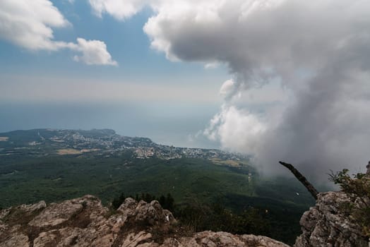 View of the city of Yalta in Crimea on the Black Sea coast from the height of the top of Ai-Petri mountain