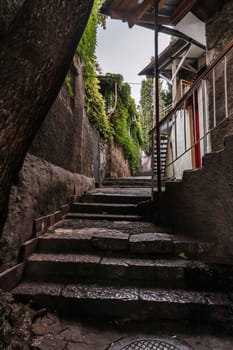 beautiful narrow alley with stone trim and facades of buildings in the Crimea In Gurzuf