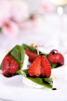 Strawberries, cheese, fresh basil and balsamic come together for a bite-sized appetizer