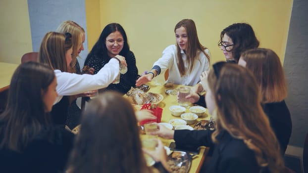 Schoolchildren put down uneaten food in the canteen