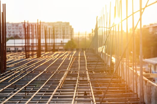 Reinforcement frame of the interfloor ceiling and columns of a building under construction.