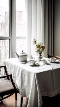 A table with a white tablecloth and a vase of flowers in the center. The table is set with plates, cups, and utensils. Scene is elegant and inviting