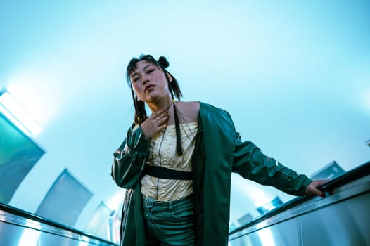 Portrait of an Asian young woman on the escalator in the subway