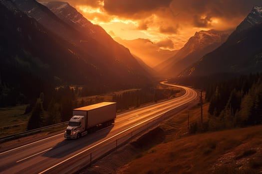 A red semi truck is driving down a mountain road at sunset. The road is narrow and winding, with a beautiful view of the mountains in the background. The sky is filled with orange and pink hues