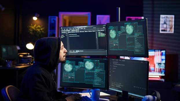 Hacker happy after successfully penetrating firewalls using malware, seeing access granted notification. Rogue programmer successfully gaining access to victim data, camera B