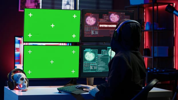 Happy man writing code on green screen PC, celebrating after managing to get past security systems. Joyous hacker feeling proud after breaching firewall using mockup computer, camera A