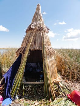 Rustic reed hut on the floating islands of puno, showcasing indigenous building techniques