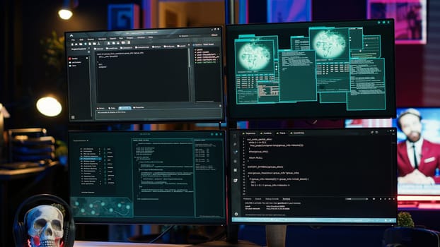 Close up of dangerous hacking lines of code running on computer monitors in criminal den. Programming scripts shown on PC displays in empty hideout used by cybercriminals to steal data