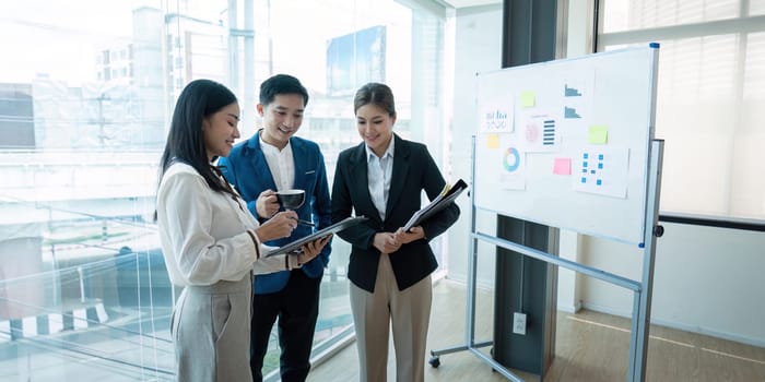 Business team collaborating together in a modern office setting, focusing on teamwork and strategy planning