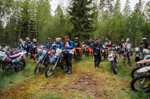 REPUBLIC OF KARELIA, RUSSIA - CIRCA JUNE, 2022: Off-road tournament Ladoga Trophy 2022 in Karelia. Motorcycle racers on sport off-road motorcycles before the start of the race