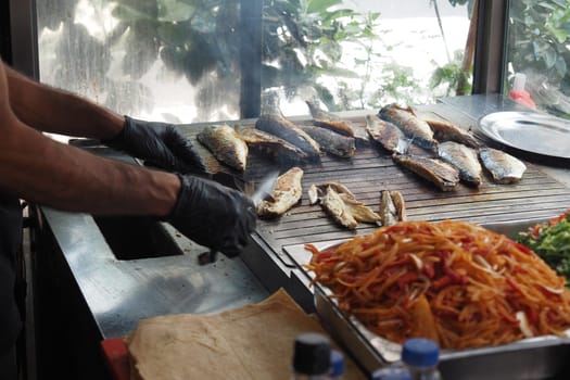 Baking and roasting fish on barbecue grill