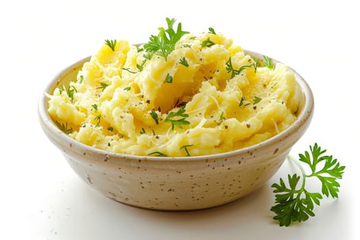 a dish of mashed potatoes with parsley in a bowl ..
