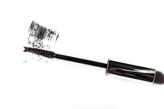 Beauty texture, cosmetic product and art of make-up concept - Black mascara brush stroke close-up isolated on white background