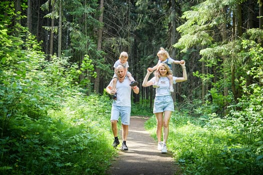 Family playing in the forest
