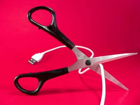 cutting wire with scissors - tech, internet, information and communication styled concept, elegant visuals