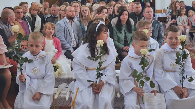 Pervomaysk, Belarus - June 17, 2022: Children's First Catholic Communion