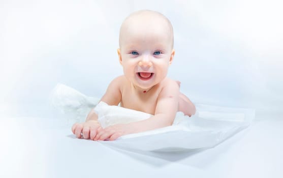 a baby with a hemangioma on his neck lies on a white background. banner with a copy space. profile of a little bald baby girl. the kid looks to the side