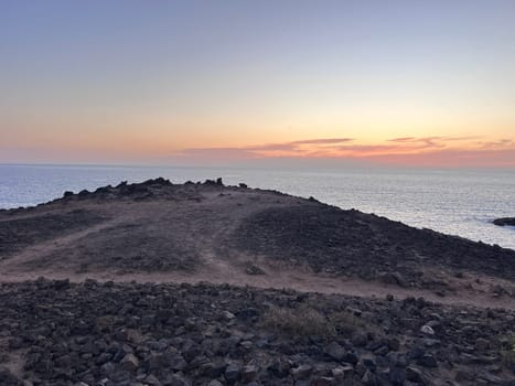 In mid-spring, when the barrilla (Messembryanthemum) dries up, the lavas of Rasca (Tenerife) turn red. High quality photo