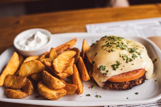 Pljeskavica and fries. Cafe. High quality photo