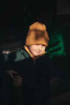 portrait of Caucasian child boy on the stairs in the entrance