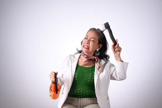 Senior woman holding halloween pumpkin baskets isolated white background.