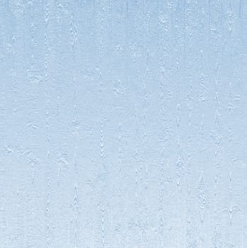 The surface is blue with a natural wood pattern and roughness
