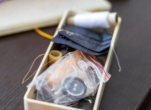 Close up shot of the box with sewing supplies