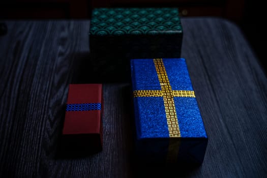 Boxes with gifts on a wooden table. High quality photo