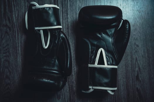 Boxing gloves on a wooden table. High quality photo