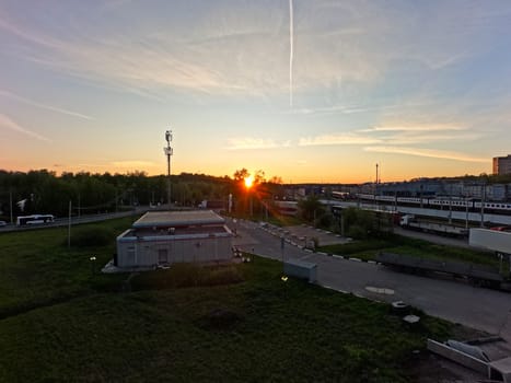 Sunset against the background of railway infrastructure solutions. sunset over the depot. High quality photo