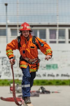 A firefighter, clad in professional gear, undergoes rigorous training to prepare for the hazards awaiting him on duty