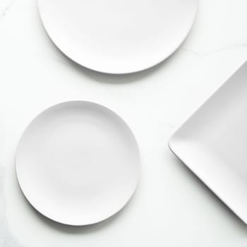 White empty plate on marble, flatlay - stylish tableware, romantic table decor and food menu concept. Serve the perfect dish