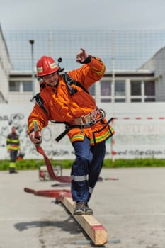 A firefighter, clad in professional gear, undergoes rigorous training to prepare for the hazards awaiting him on duty