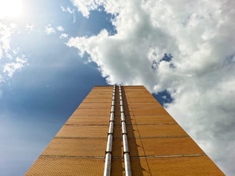 The corner of the infrastructure building in a residential area. Against the sky , under the sun. High quality photo