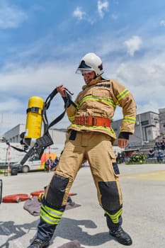 A firefighter dons the essential components of their professional gear, embodying resilience, commitment, and readiness as they gear up for a hazardous firefighting mission, a testament to their unwavering dedication to protecting and saving lives.