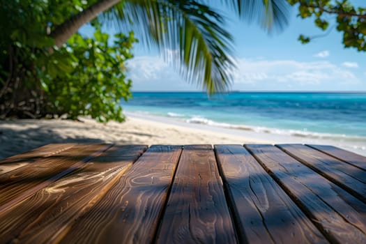 A wooden table is set up on the sandy beach, with a majestic palm tree standing tall in the background. The natural landscape features a beautiful blend of water, sky, and coastal elements