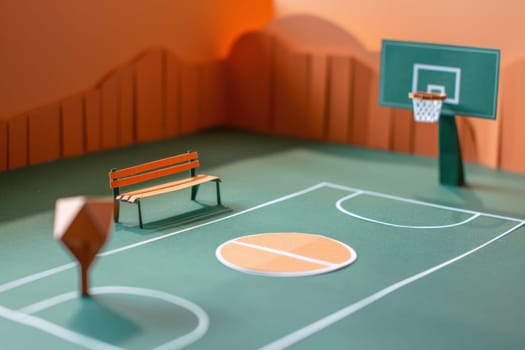 Paper model of basketball court with bench and basketball hoop for sports and recreation enthusiasts