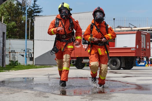 A team of confident and accomplished firefighters strides purposefully in their uniforms, exuding pride and satisfaction after successfully completing a challenging firefighting mission.