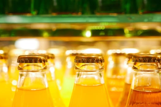 At the grocery store, the fridge offers bottled juices, providing vibrant and refreshing beverage options