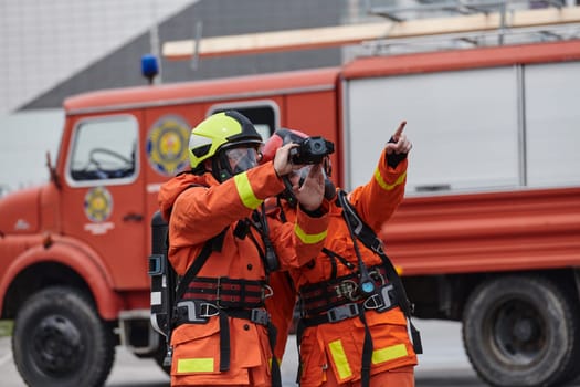 A group of firefighters undergoes training to learn how to effectively use a thermal camera in firefighting operations.