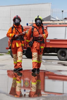 A team of confident and accomplished firefighters strides purposefully in their uniforms, exuding pride and satisfaction after successfully completing a challenging firefighting mission.