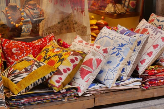 Colourful cushions on display for sale in a traditional Turkish Bazaar