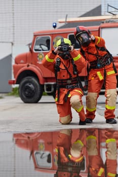 A group of firefighters undergoes training to learn how to effectively use a thermal camera in firefighting operations.